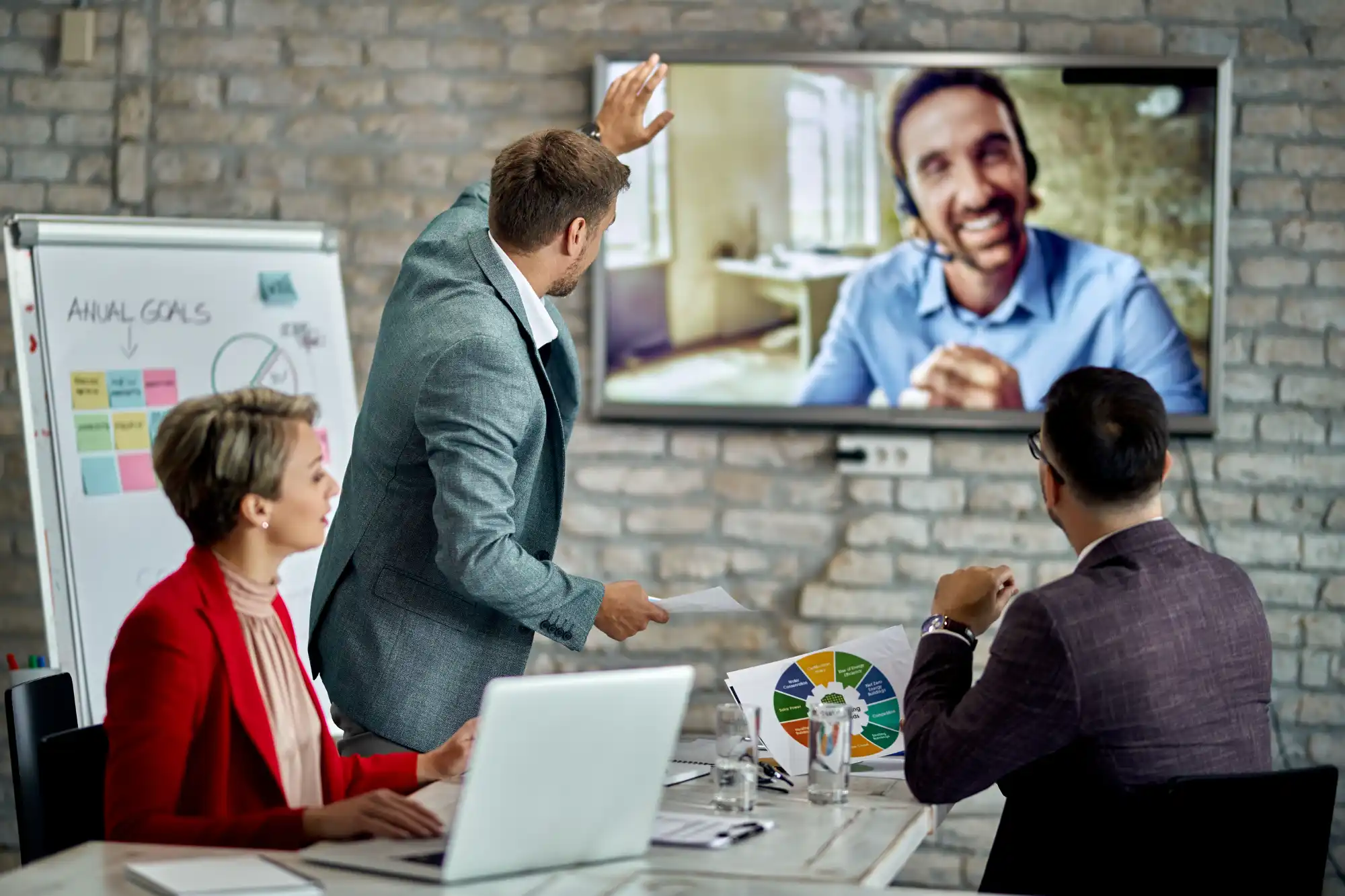 Premium hybrid boardroom meeting in progress
